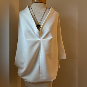 Cream, back zip top with fitted sleeves